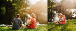 family of four snuggles on the banks of the Subury River at Concord's Old North Bridge